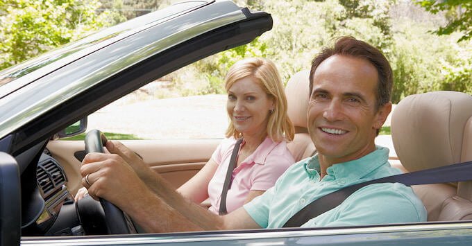 mature couple in a convertible